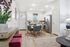 Modern apartment kitchen and dining area featuring sleek stainless steel appliances, stylish cabinets, and a cozy dining table with plush seating. Bright and inviting space with elegant decor and abundant natural light.