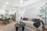 Contemporary open-concept living space with modern kitchen, stylish dining area, and cozy lounge with plush decor.
