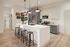Chic modern kitchen with stylish pendant lighting, spacious island, and sleek stainless steel appliances.