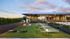 Elegant rooftop lounge with modern architecture, lush green lawn, and cozy seating for relaxation and entertainment.