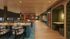 Modern co-working space with stylish seating, vibrant decor, and warm lighting, ideal for creativity and collaboration.