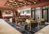 Chic apartment lounge with colorful tile backsplash, plush seating, and stylish decor, perfect for relaxation and entertaining.