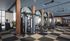 Modern gym with state-of-the-art fitness equipment, striking wood accents, and large mirrors for an inspiring workout environment.