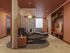 Chic wellness room with sleek reclined massage chairs, ambient lighting, and stylish wooden accents for relaxation.