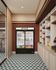 Chic mini-market space with a variety of beverages and snacks, featuring elegant tiled flooring and ambient lighting.