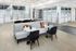 Chic modern lobby with stylish furniture, marble tables, and colorful cushions complementing an elegant design, perfect for relaxation and social gatherings.