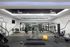 Modern fitness center with state-of-the-art equipment, sleek mirrors, and vibrant exercise balls, perfect for a dynamic workout experience.