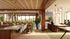 Modern, spacious open-concept apartment with elegant decor featuring a stylish kitchen island, sleek bar stools, and a cozy dining area with lush greenery and abundant natural light.
