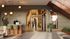 Inviting apartment lobby with elegant modern decor, featuring stylish lighting, a welcoming reception area, and comfortable seating for a chic living experience.
