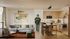 Modern apartment interior with sleek kitchen and stylish living area, featuring Oregon-themed decor and natural wood finishes.