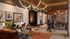 Vibrant communal lounge with modern decor, cozy seating, and lively social atmosphere.