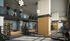 Modern fitness center with state-of-the-art equipment, featuring a mezzanine level with cardio machines and a spacious weightlifting area below.