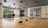Modern fitness studio with large mirrors, Pilates reformers, and yoga mats, offering a serene workout environment with natural light and garden views.
