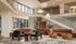 Modern common area with stylish furniture, warm lighting, and elegant decor, featuring a mix of contemporary art and comfortable seating.
