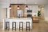Modern kitchen with sleek island, stylish pendant lighting, and wood cabinetry for a sophisticated touch.