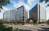Modern high-rise buildings with sleek glass exteriors, surrounded by lush greenery and vibrant landscaping, under a clear blue sky.