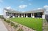 Charming modern house with a spacious lawn, sleek wooden pillars, and cozy outdoor seating, perfect for stylish living.