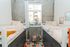 Chic bedroom with stylish bunk beds, bright natural light, and tasteful decor creating a cozy urban retreat.