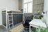 Chic apartment bedroom with a modern loft bed, stylish workspace, and abundant natural light.