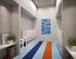Modern and stylish laundry room featuring sleek washers and dryers, vibrant flooring, and contemporary art decor.