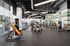 Modern fitness center featuring state-of-the-art gym equipment, bright lighting, and a spacious layout.