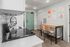 Contemporary kitchen with sleek appliances, stylish dining nook, and modern wall art, perfect for urban living.