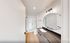 Elegant bathroom with a modern glass-enclosed shower, sleek vanity, and stylish round mirror providing a luxurious feel.