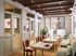 Elegant and inviting coworking space with plush seating, warm lighting, and modern decor.
