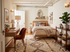 Cozy and stylish bedroom with warm tones, featuring a chic desk, plush chair, and elegant decor for an inviting atmosphere.
