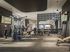 Modern fitness center with state-of-the-art equipment, stylish design, and ample natural lighting.