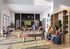 Vibrant community lounge with modern billiard table, cozy seating, and large screen for entertainment.