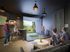 Luxurious entertainment room featuring a golf simulator, dartboard, and flat-screen TV, perfect for social gatherings and leisure activities.