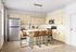 Modern kitchen with light wood cabinets, sleek stainless steel appliances, and a stylish island featuring chic bar stools, inviting natural light.