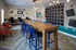 Inviting community lounge with stylish decor, featuring a long wooden table, modern seating, and vibrant wall art. Perfect for social gatherings and study sessions.
