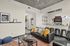 Chic urban apartment with contemporary decor, featuring a cozy living area with stylish furniture, colorful pillows, and a modern kitchen equipped with sleek appliances. Perfect for city living with artistic touches and abundant natural light.