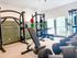 Bright and modern fitness center equipped with state-of-the-art gym equipment and large windows for natural light.