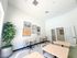 Bright and modern dining area with elegant tables, comfortable chairs, and vibrant wall art, ideal for communal gatherings.