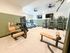 Modern fitness center with state-of-the-art cardio machines, strength equipment, and ample space for workouts.