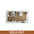 Cozy studio apartment floor plan featuring a modern kitchen, bathroom, and open sleeping area with stylish wooden flooring.
