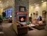 Welcoming lobby area at The Crest at Elm Tree Apartments, complete with a fireplace and plush couches for comfort.