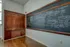 Chalkboard and built in cabinet from original school building.