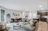 A bright and airy modern living room and kitchen in a two-bedroom apartment, designed for comfort and style at Lofts at Yard 56.