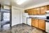 Modern kitchen showcasing a refrigerator, stove, and microwave at Bright Meadows Townhomes.