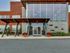 A charming entrance of brick and glass marks the exterior of the Lancaster Lofts building.
