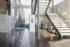 The lobby of Lancaster Lofts features a bike rack and stairs, blending convenience with stylish architecture.