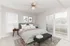 Inviting bedroom at Hampton Point Apartment showcasing a bed, a chair, and a sliding glass door for fresh air.