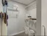 Inside a chic walk-in closet at 500 Park Avenue Apartments, showcasing a basket and organized clothing items.