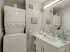 A neat white washer and dryer in a bathroom setting at 500 Park Avenue Apartments.
