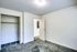 Spacious empty bedroom in Allyson Gardens Apartments, complete with a closet and inviting carpet.