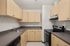 Transform your cooking space with a modern kitchen design featuring sleek, high-end appliances, and custom modern cabinetry.